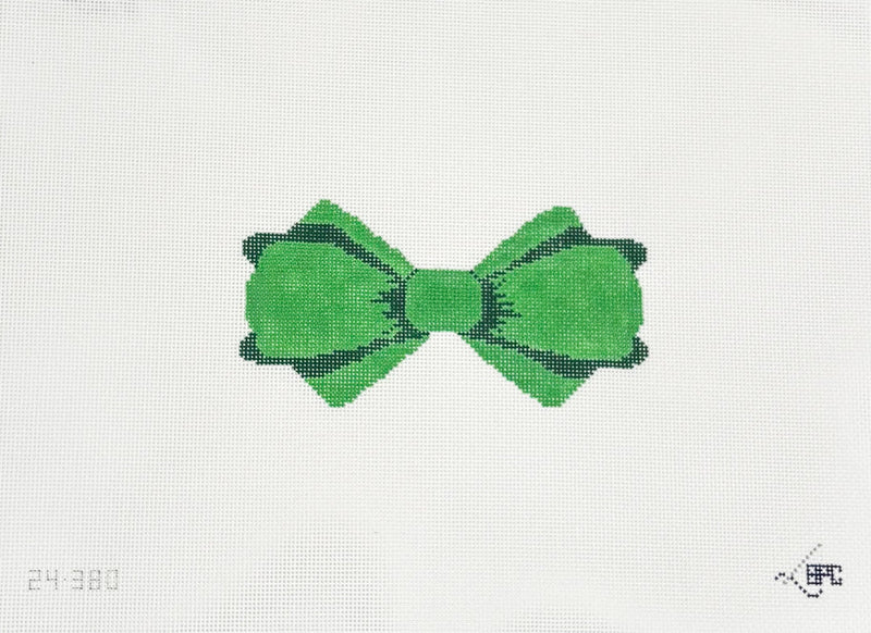 Green bow design on a white fabric background