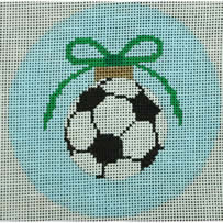 soccer ball with green bow on pale blue