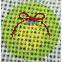 tennis ball with red bow on green