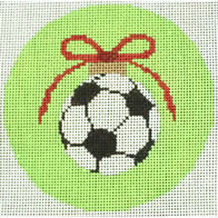 soccer ball with red bow on green