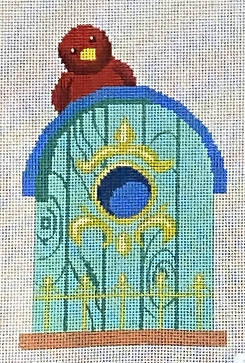 Turquoise birdhouse with red bird