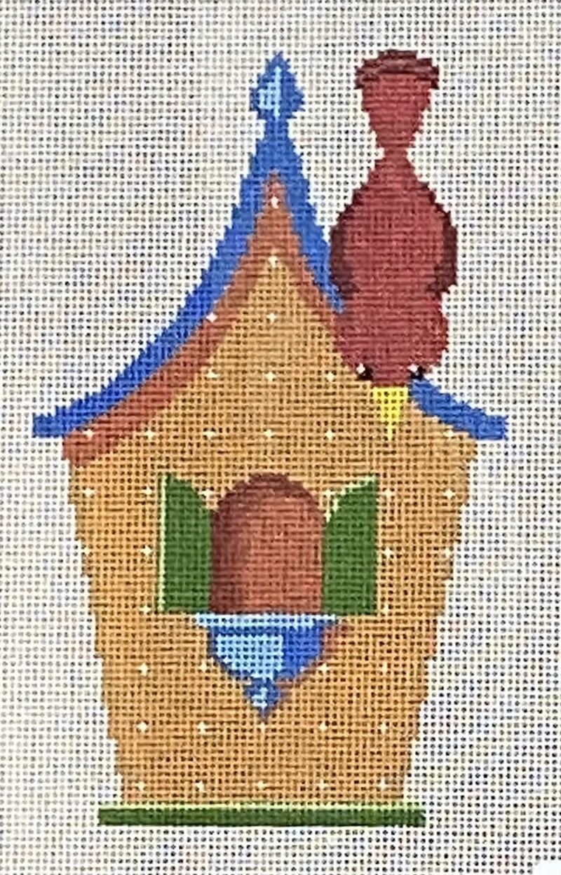 Brown birdhouse with red bird