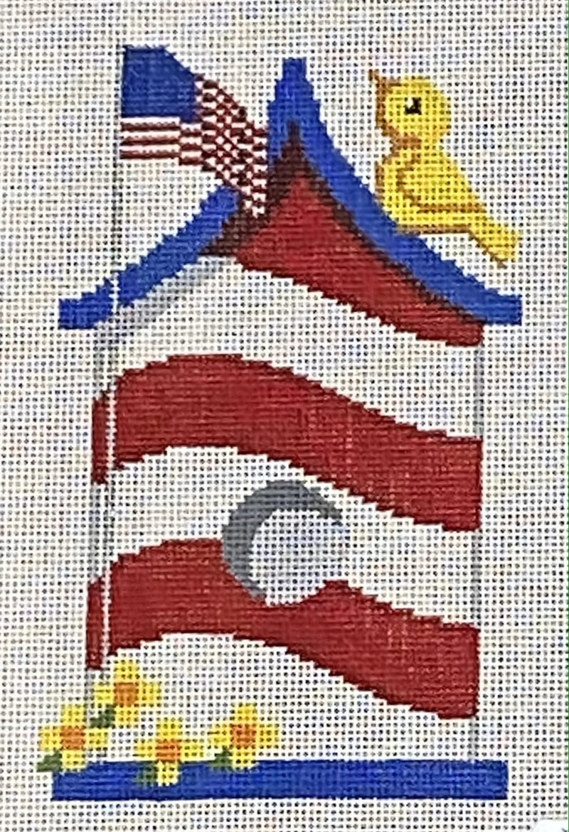 Red, white and blue birdhouse with yellow bird