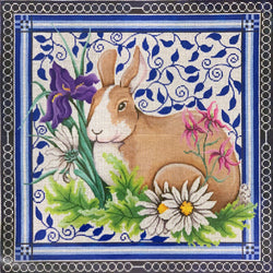 Patti Mann Bunny in garden, on blue leaves and blue border Canvas